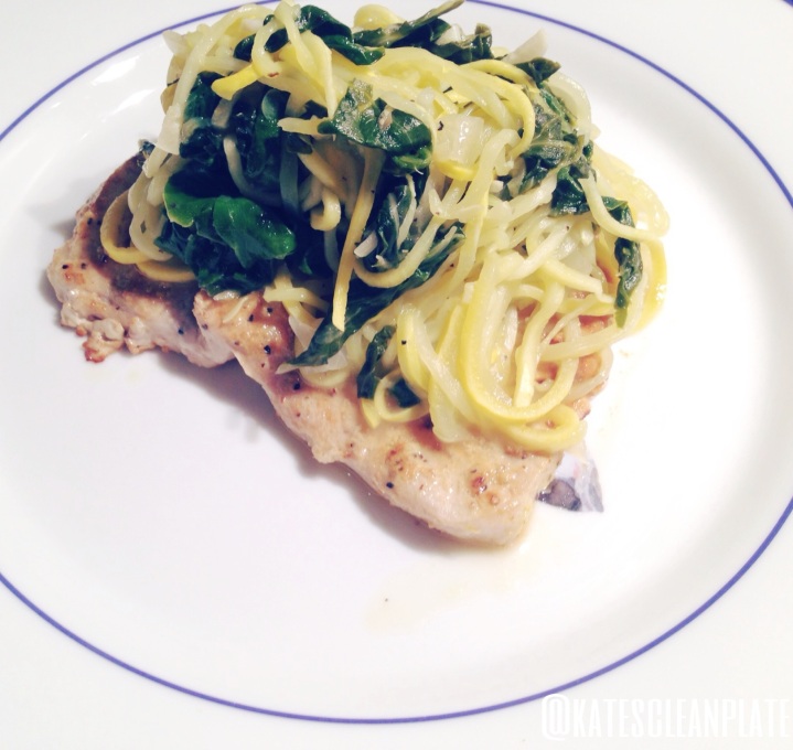 Pork chops with yellow squash noodles, swiss chard and caramelized onions